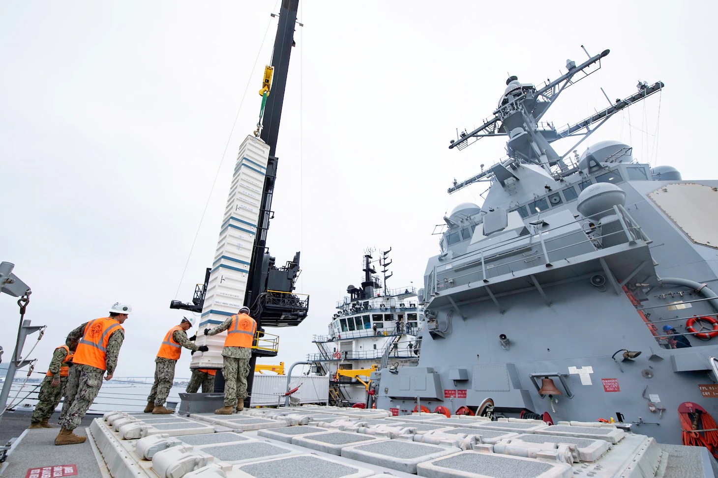 Vertical Launch System (VLS) cells of the USS Spruance being reloaded by the MV Ocean Valor in San Diego