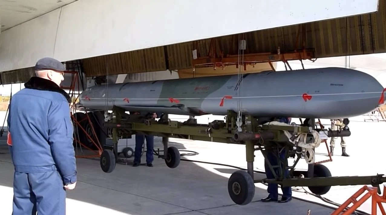 A-Russian-Kh-101-cruise-missile-being-loaded-onto-a-bomber-aircraft.webp